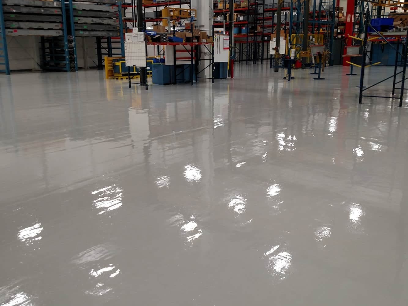 Warehouse aisle with a high-gloss gray floor coating